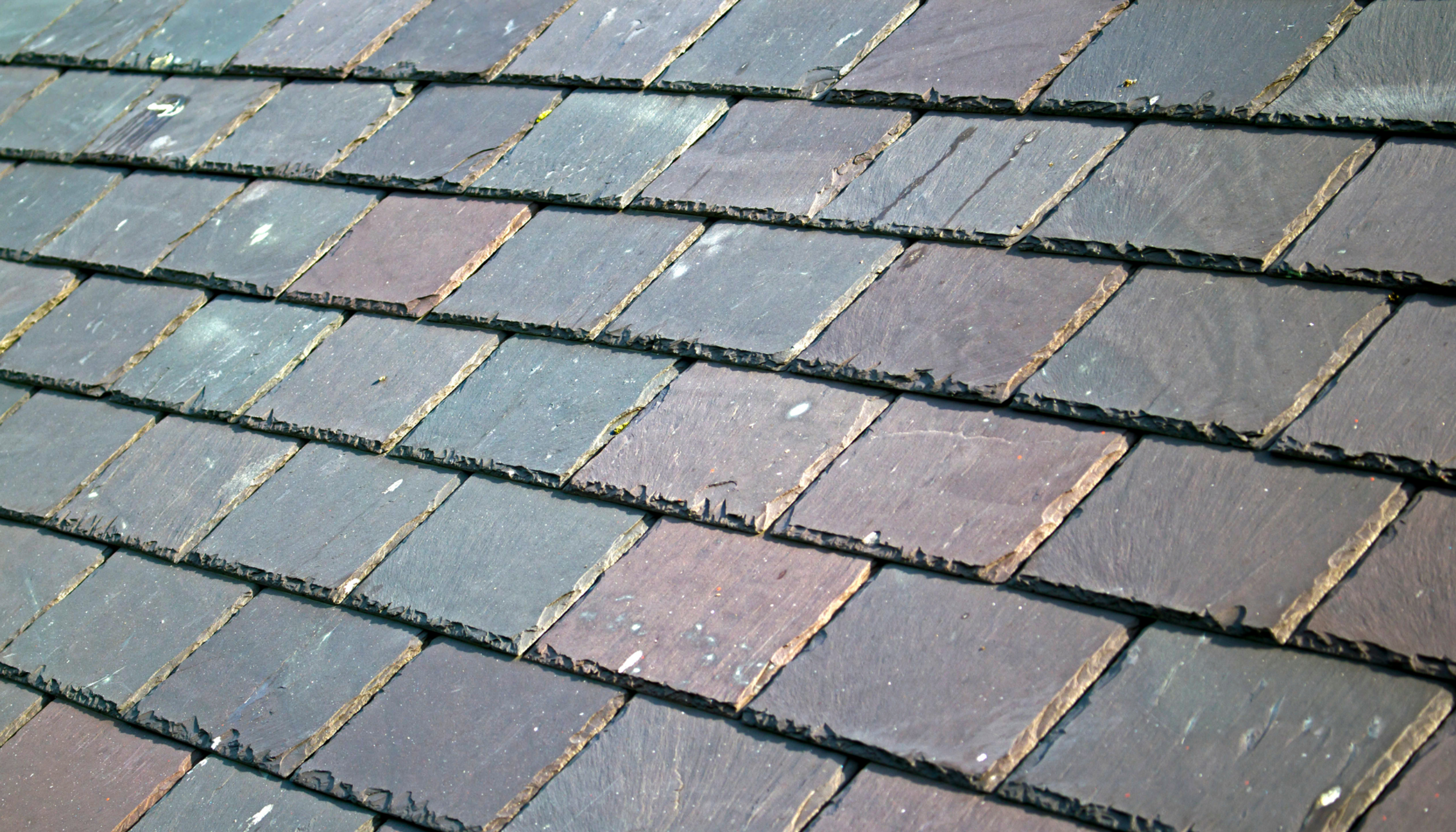 "Close-up of stone slate roof showcasing durable roofing material."